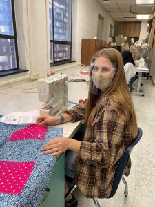 Student working on sewing project