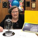 Dr. Amy Carrell posing with award.
