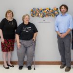Jan Hardt, Pat Bolt, Eric Hoefer and Cathy Webster pose in front of the art piece titled Hope.