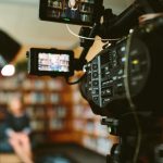 Camera recording an interview of woman