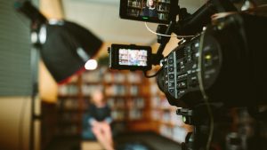 Camera recording an interview of woman