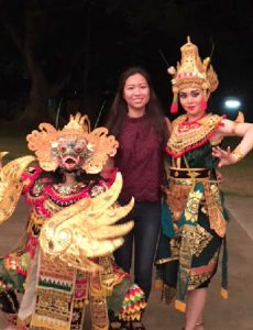 Anh Dinh poses with Balinese dancers