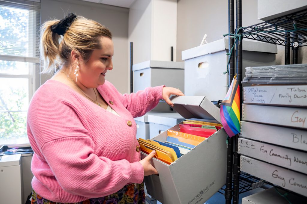 UCO grad student Alexis McKernan sorts through materials from the Herland Archives