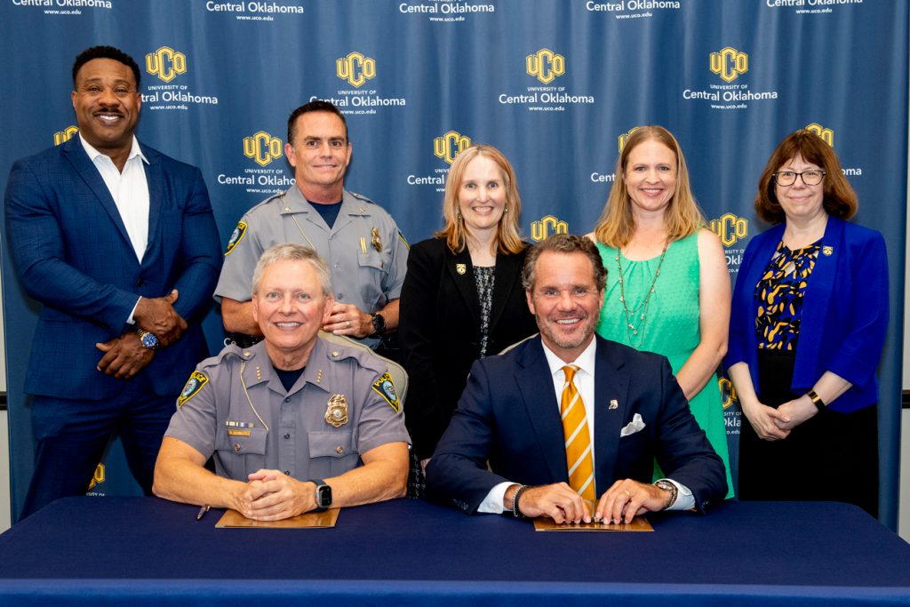 group photo of reprsentatives from the University of Central Oklahoma, The UCO College of Liberal Arts and OKCPD