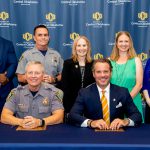 group photo of reprsentatives from the University of Central Oklahoma, The UCO College of Liberal Arts and OKCPD