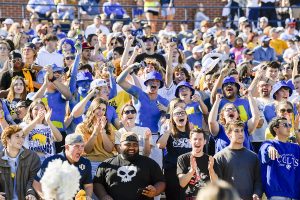 UCO students cheering at a football game. 